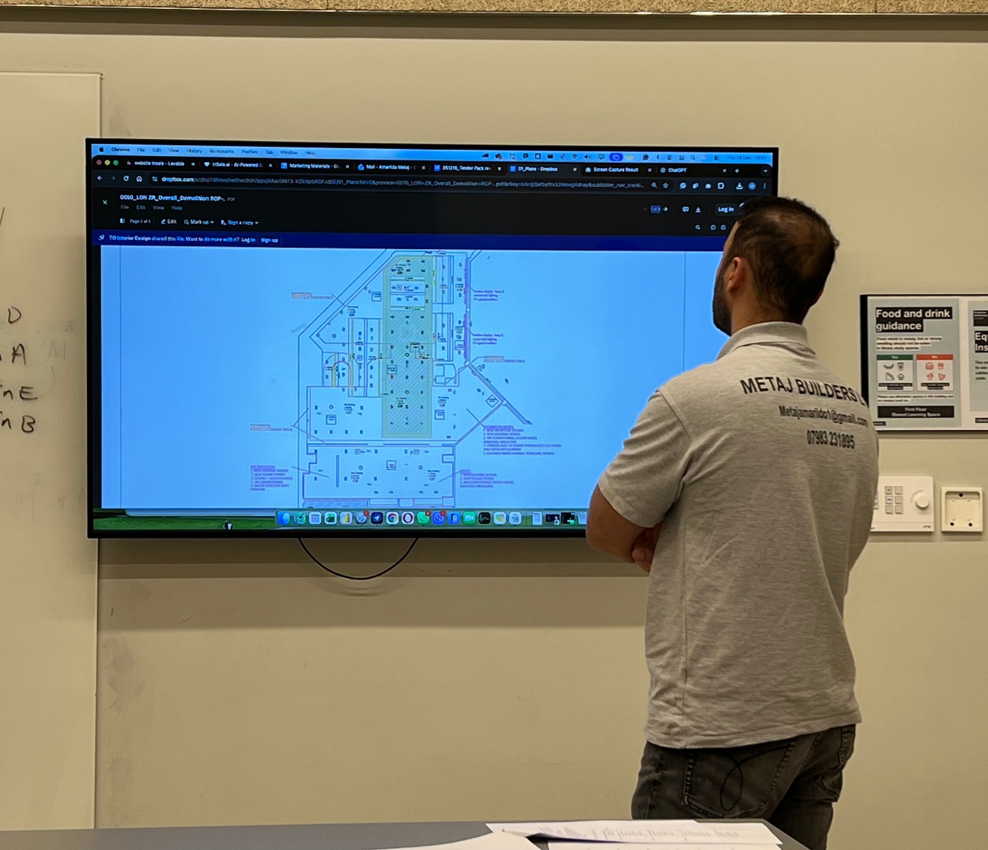 Amarildo Metaj reviewing project drawings on site